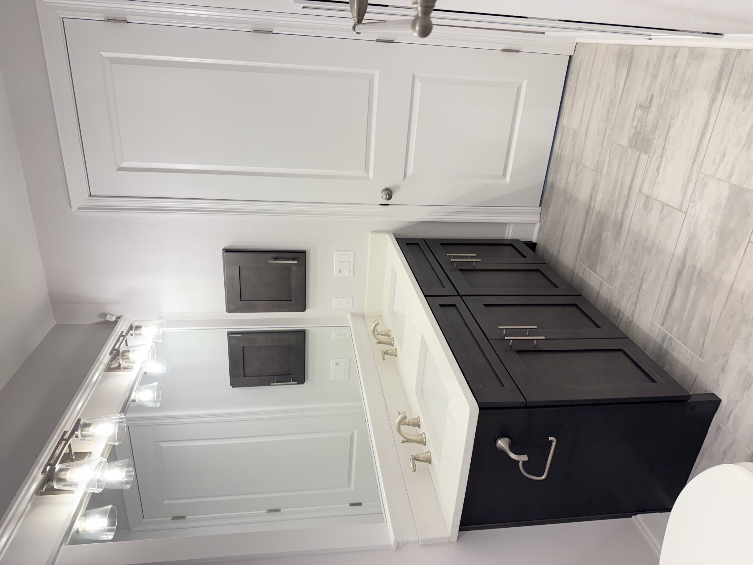 Bathroom with vanity and tile shower