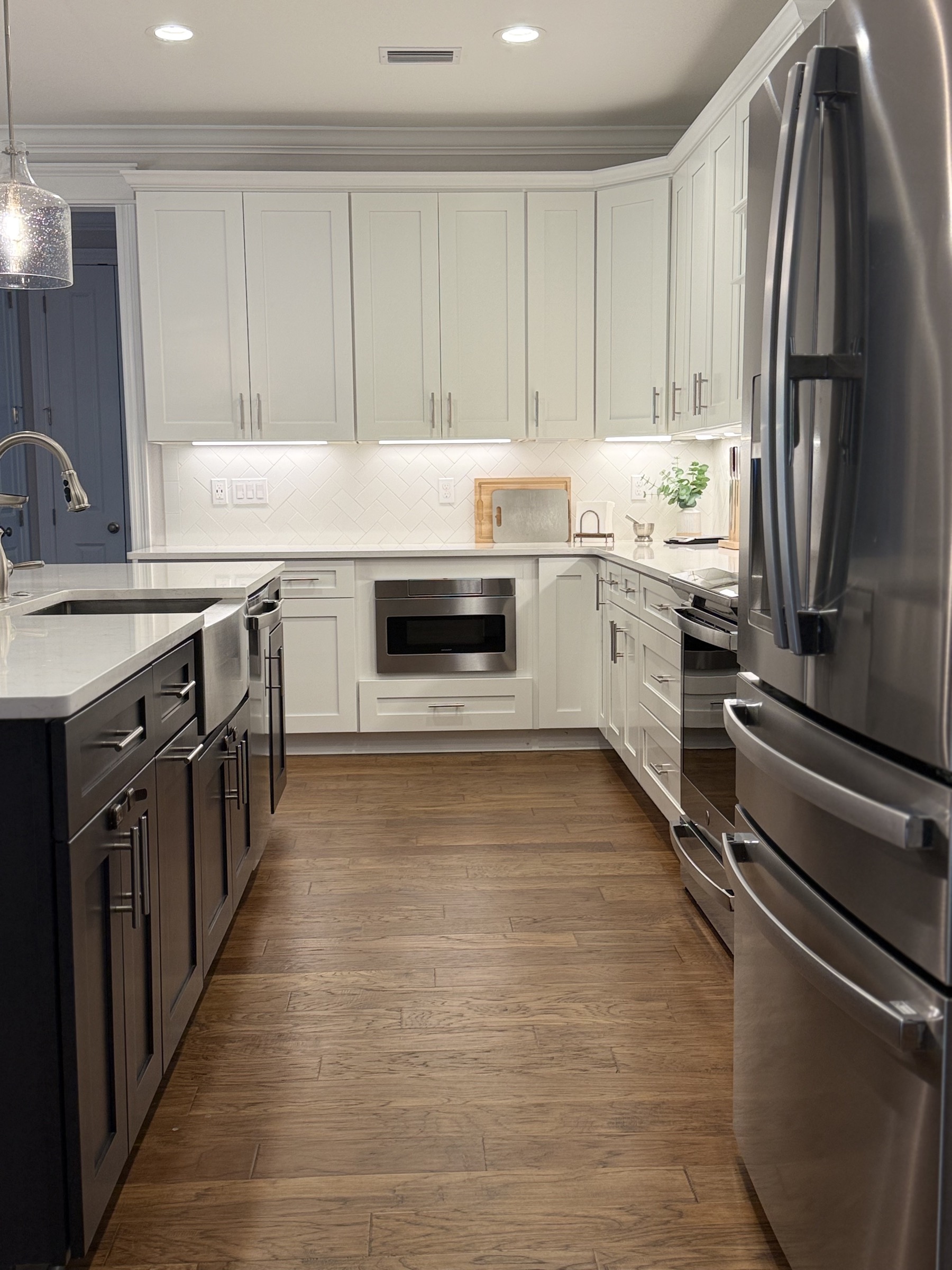 Kitchen view with island seating and bright finishes