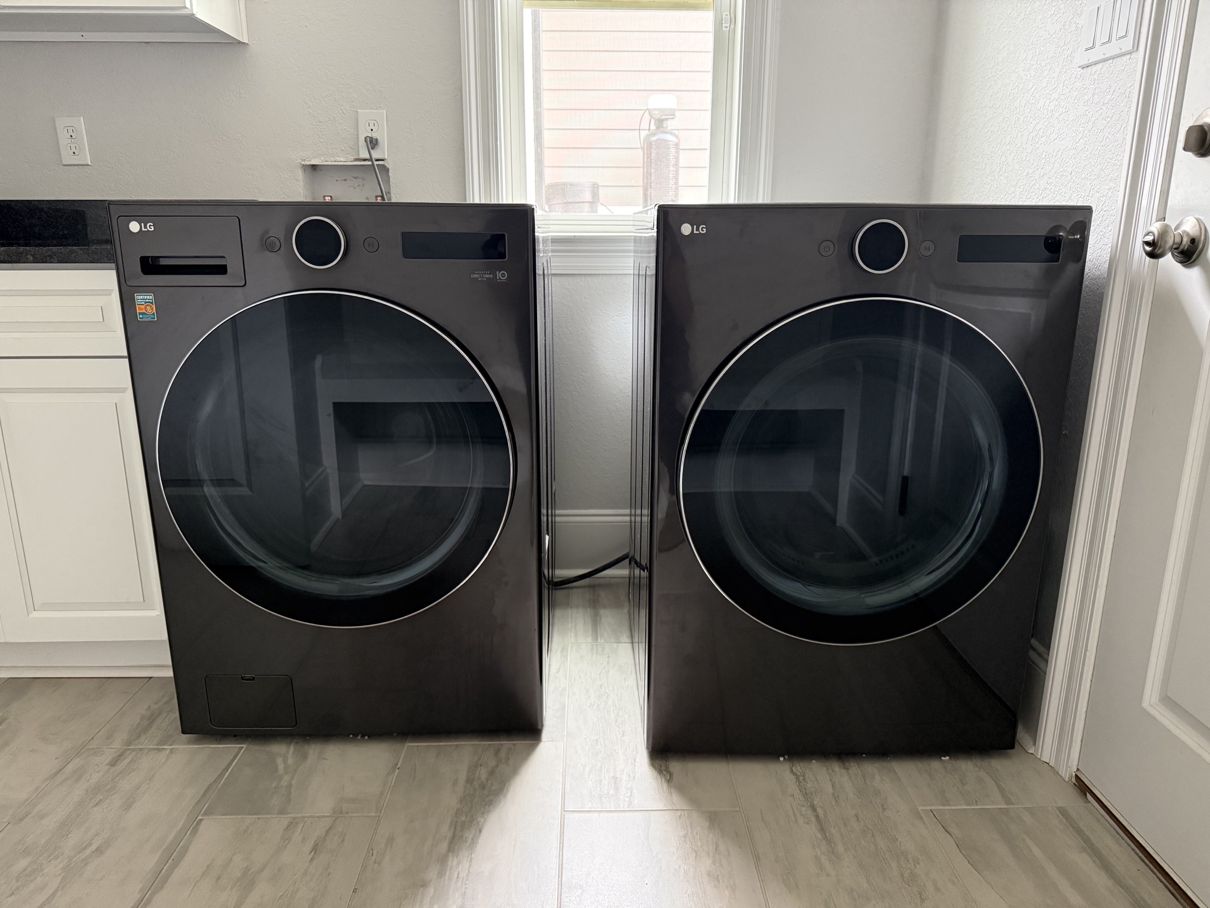 Laundry room with smart washer and dryer