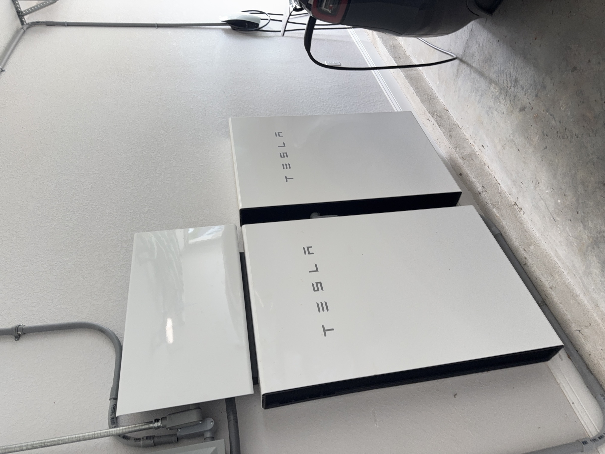 Garage with Tesla Powerwalls and home energy equipment